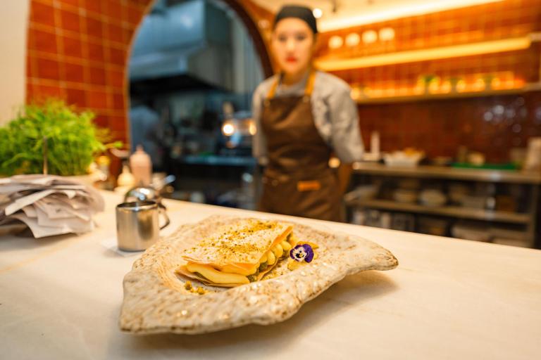 A plated Mediterranean dish from the SOLH kitchen and grill